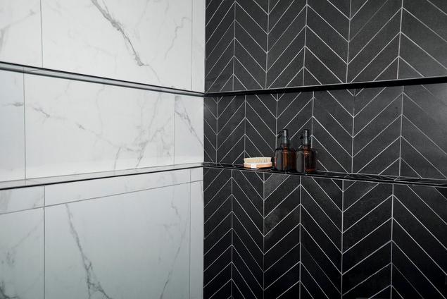 Close up of black chevron mosaic shower